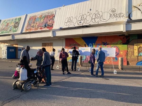 Group of people gathered outside of a building