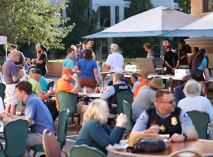 Group of people sitting at tables for National Night Out Group of people sitting at tables for National Night Out