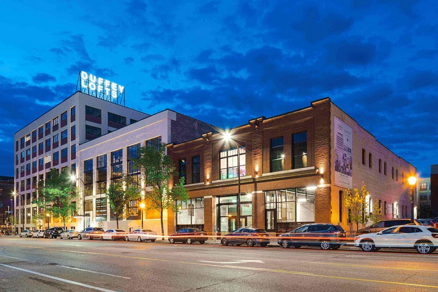 Exterior view of three attached buildings on a city street