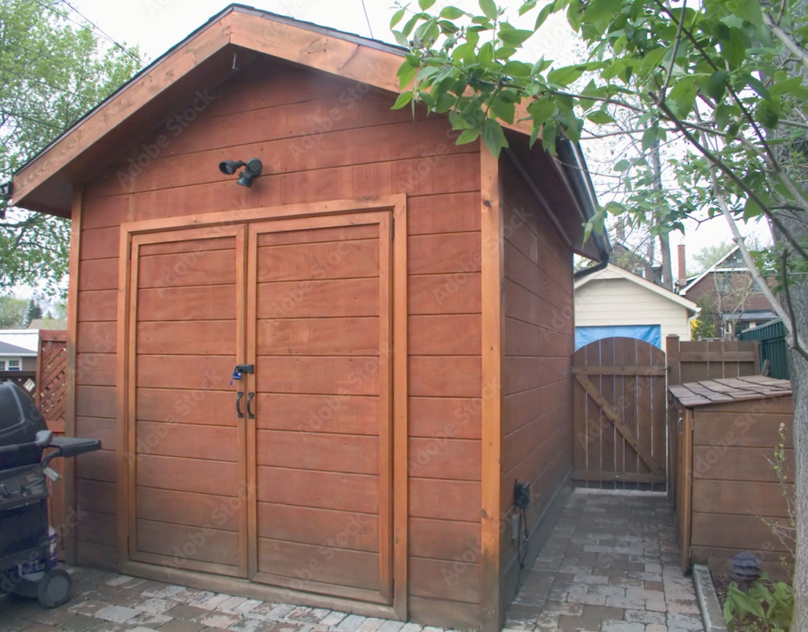 Brown shed in urban backyard