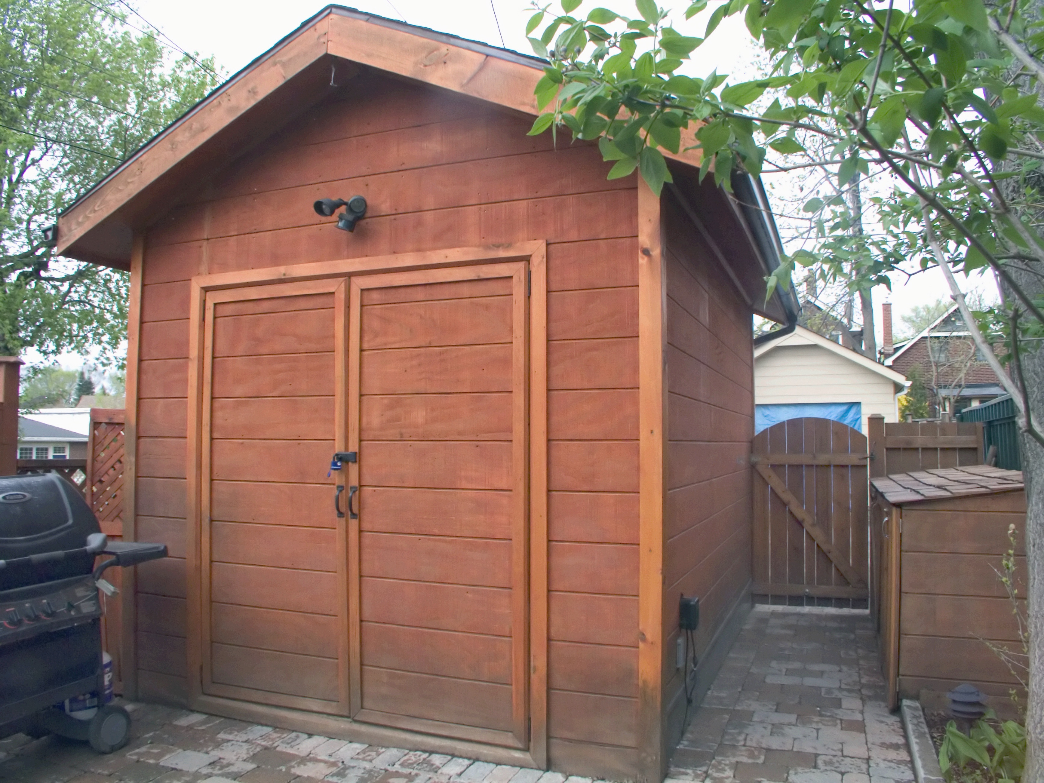 Brown shed in urban backyard