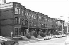 Sepia image of rowhouses from the street taken in 1974.